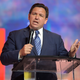 Florida’s Republican Gov. Ron DeSantis addresses attendees during the Turning Point USA Student Action Summit on July 22, 2022, in Tampa, Fla. Newly released police bodycam footage shows that three of the 20 people who were arrested in Florida for allegedly voting illegally in the 2020 election appeared to be surprised that they had done anything wrong. The recordings, made by local police and obtained by the Tampa Bay Times, were published Tuesday, Oct. 18, 2022, after DeSantis announced charges against the suspects in August as the first major public move of his controversial election police unit.